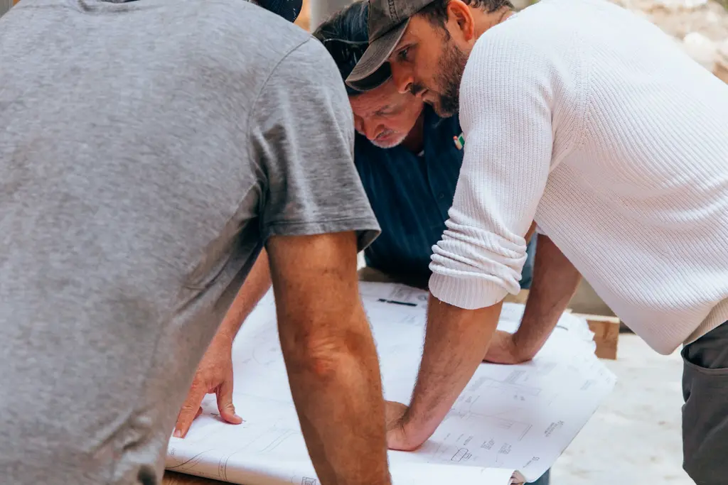 Contractors reviewing plans